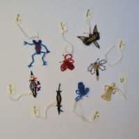 collection of small glass bead brooches